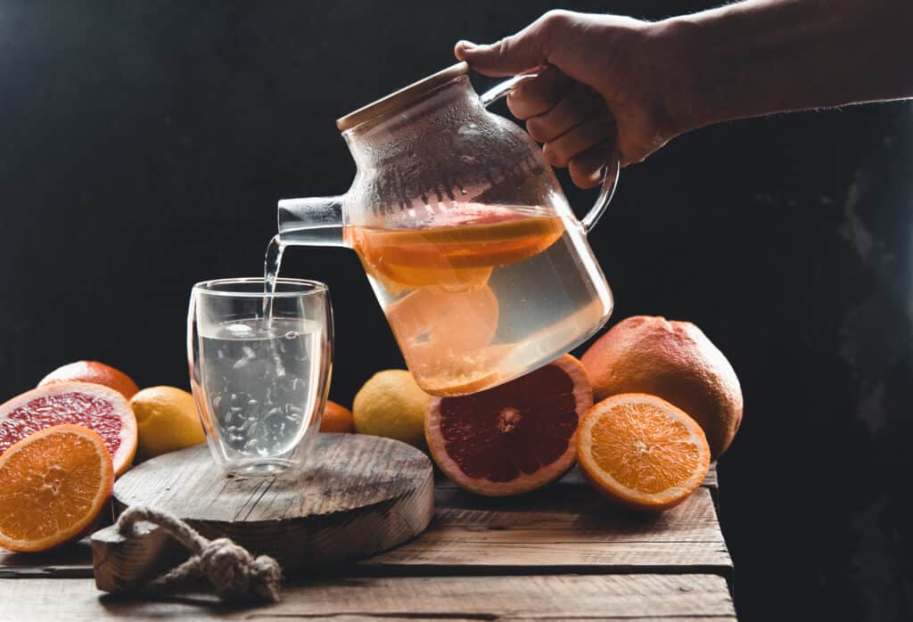 citrus tea in a transparent teapot and a glass he 2023 11 27 05 03 35 utc